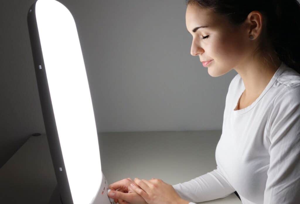 Light therapy can help boost your mood and regulate serotonin levels.